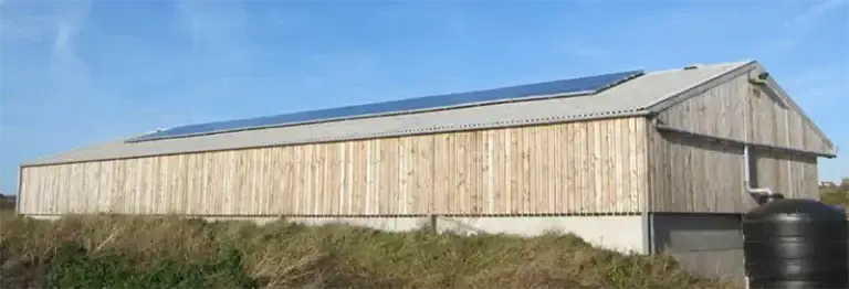 Solar PV and rainwater recovery system on farm building at Caerfai Farm