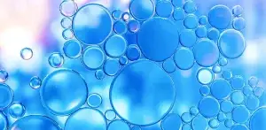 Graphic interpretation of Hydrogen H2 with clear bubbles on a blue background